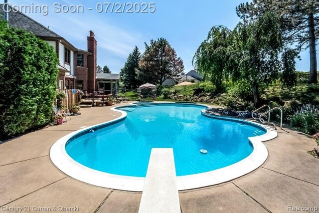 31085 Estate Woods Ct, Farmington Hills, MI 48331 - view of pool with a diving board and a patio area