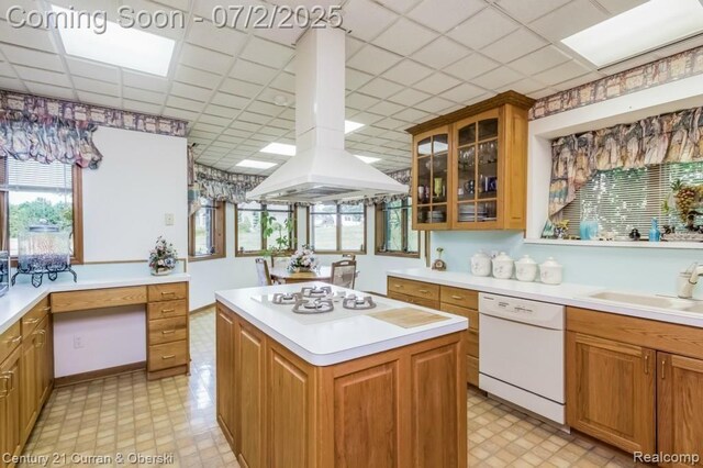 31085 Estate Woods Ct, Farmington Hills, MI 48331 - kitchen with white appliances, island exhaust hood, light countertops, light floors, and a paneled ceiling