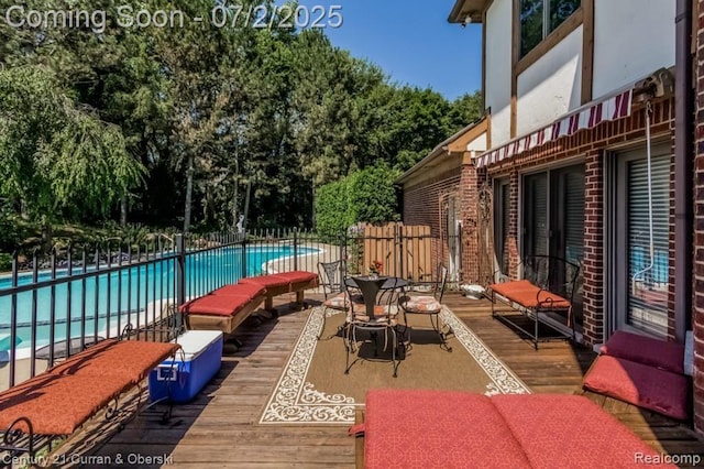 31085 Estate Woods Ct, Farmington Hills, MI 48331 - view of patio / terrace with a community pool, a deck, and view of scattered trees