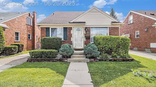 9269 Hubert Ave, Taylor, MI 48101 - bungalow-style home featuring a front lawn and brick siding