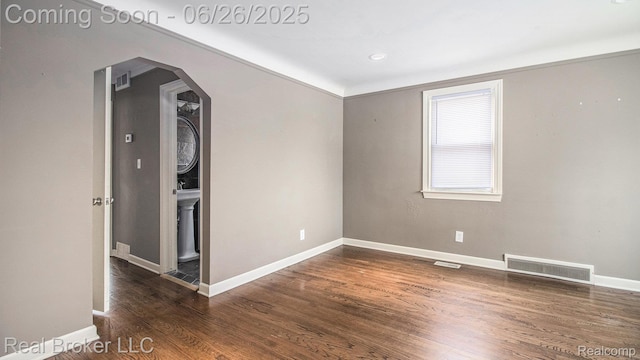 9269 Hubert Ave, Taylor, MI 48101 - unfurnished room with arched walkways and wood finished floors