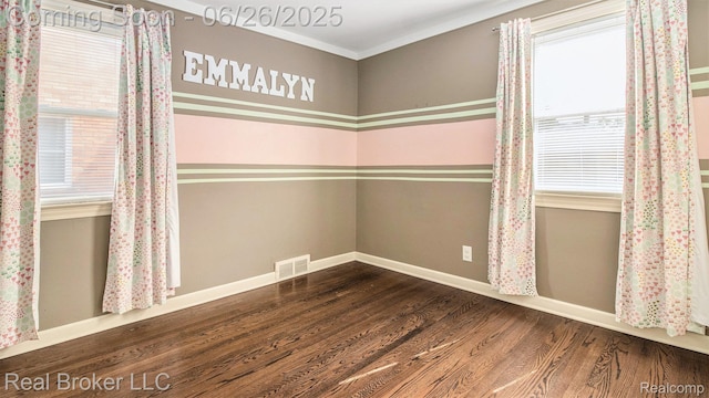 9269 Hubert Ave, Taylor, MI 48101 - unfurnished room with wood finished floors and plenty of natural light