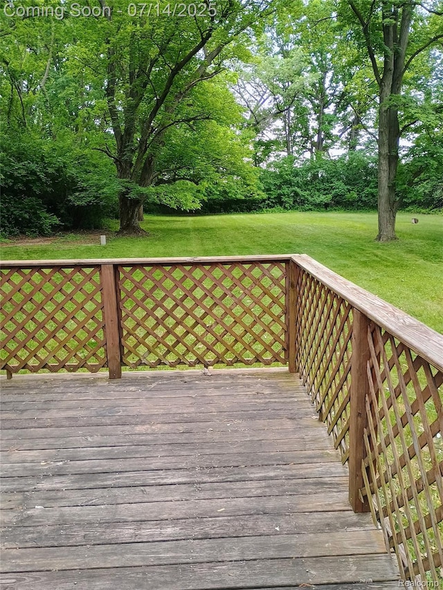 19241 Melrose Ave, Southfield, MI 48075 - wooden deck featuring a lawn