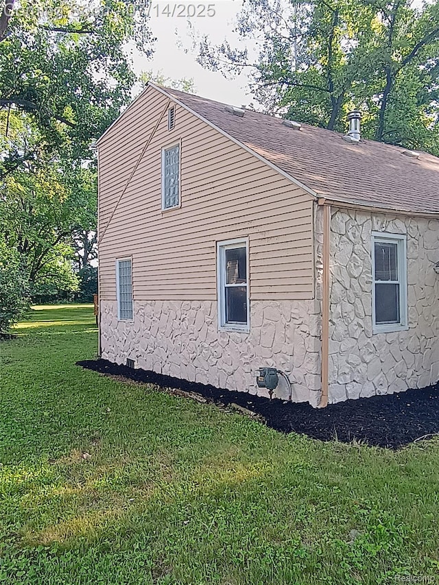 19241 Melrose Ave, Southfield, MI 48075 - view of property exterior with roof with shingles and a lawn