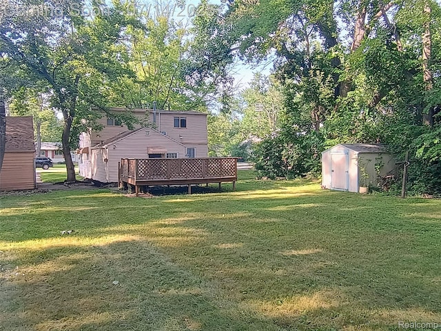 19241 Melrose Ave, Southfield, MI 48075 - view of grassy yard featuring a storage shed and a deck