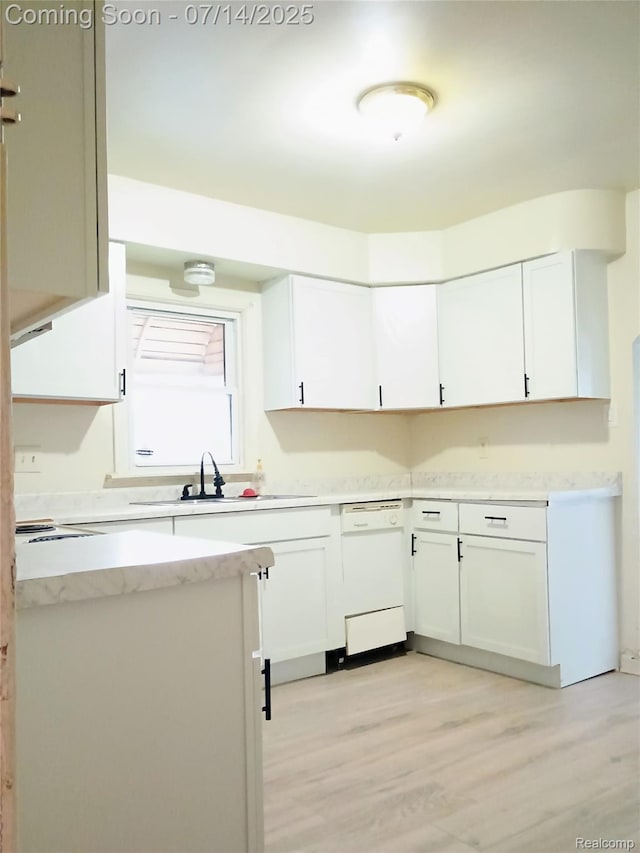 19241 Melrose Ave, Southfield, MI 48075 - kitchen featuring dishwasher, white cabinetry, light wood-type flooring, and light stone counters
