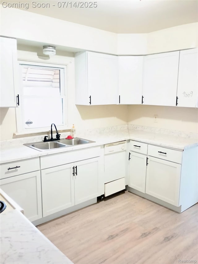 19241 Melrose Ave, Southfield, MI 48075 - kitchen featuring dishwasher, white cabinets, light countertops, and light wood-style flooring