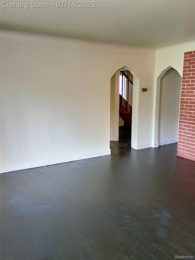 19241 Melrose Ave, Southfield, MI 48075 - unfurnished room with arched walkways and baseboards