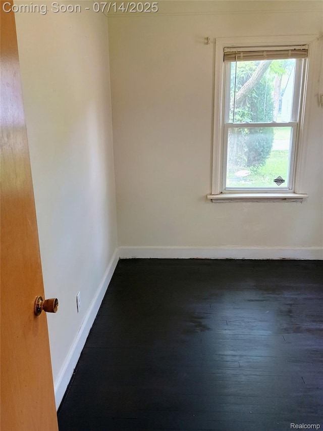 19241 Melrose Ave, Southfield, MI 48075 - unfurnished room with baseboards and dark wood-type flooring