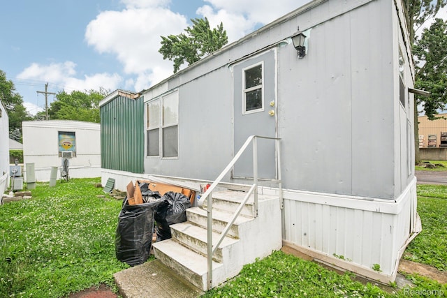 7062 Ready Ave, Warren, MI 48091 - view of side of home featuring entry steps and a lawn