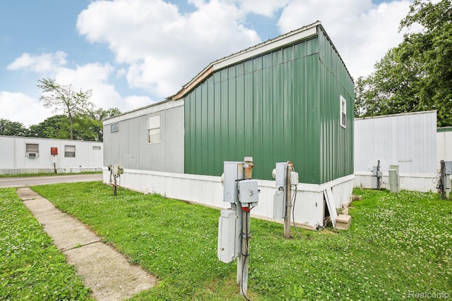 7062 Ready Ave, Warren, MI 48091 - view of home's exterior featuring a yard and board and batten siding