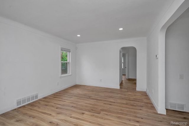 16880 Murray Hill St, Detroit, MI 48235 - unfurnished room with arched walkways, light wood-style floors, recessed lighting, and crown molding
