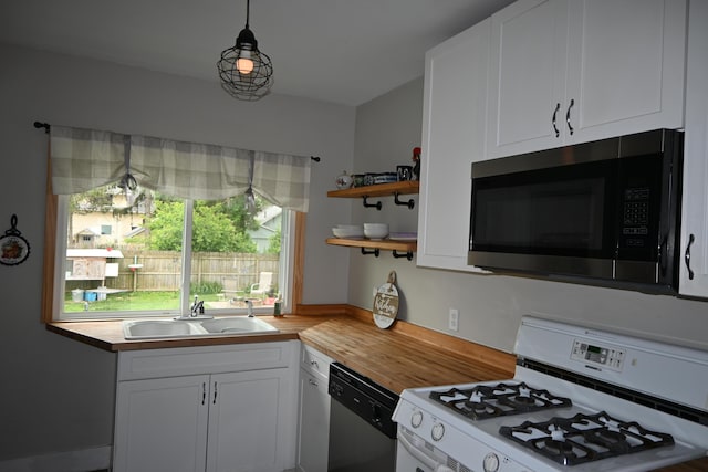 2245 Morton Ave, Muskegon, MI 49441 - kitchen with stainless steel appliances, butcher block countertops, white cabinetry, and open shelves