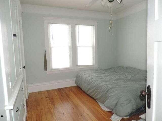 2245 Morton Ave, Muskegon, MI 49441 - bedroom with light wood finished floors and a ceiling fan