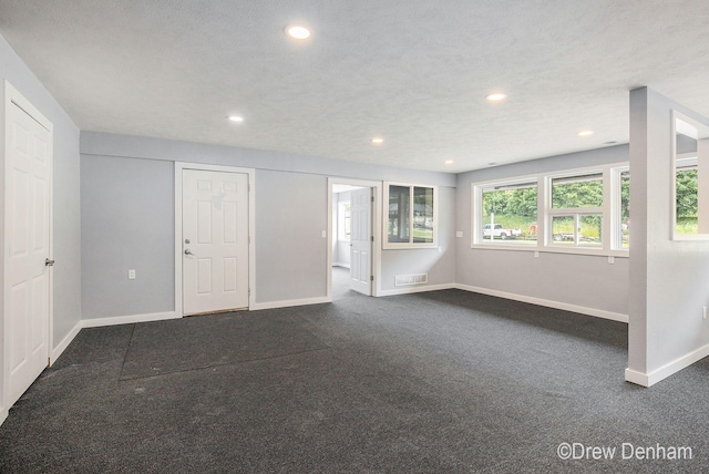 6973 W Blue Water Hwy, Saranac, MI 48881 - unfurnished living room with dark carpet and recessed lighting