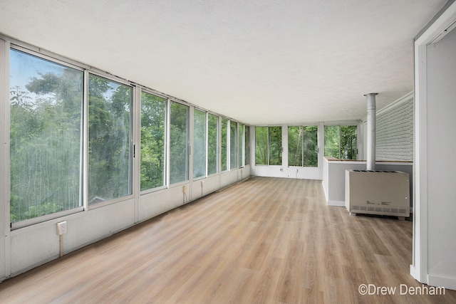 6973 W Blue Water Hwy, Saranac, MI 48881 - unfurnished sunroom featuring heating unit and plenty of natural light