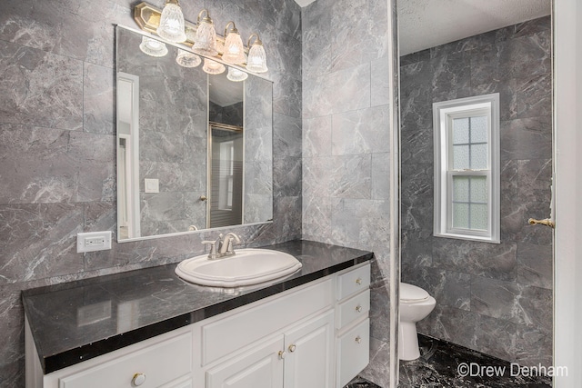 6973 W Blue Water Hwy, Saranac, MI 48881 - full bath with marble look tiles, vanity, and tile walls