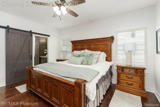 182 Fairhill Way, Howell, MI 48843 - bedroom with a barn door, dark wood-style flooring, connected bathroom, and a ceiling fan