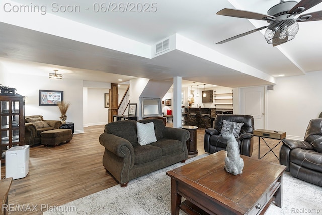 182 Fairhill Way, Howell, MI 48843 - living room with wood finished floors, stairs, and a ceiling fan