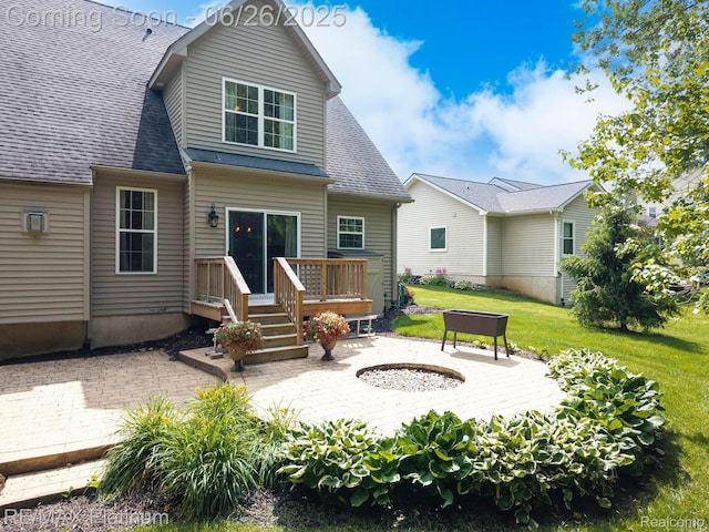 182 Fairhill Way, Howell, MI 48843 - back of house with an outdoor fire pit, a patio area, a wooden deck, and a yard