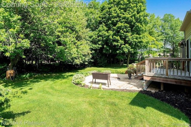 182 Fairhill Way, Howell, MI 48843 - view of grassy yard with a wooden deck and a patio area