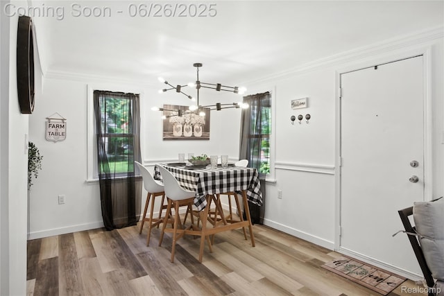 8411 Hugh St, Westland, MI 48185 - dining room with wood finished floors, a chandelier, and ornamental molding