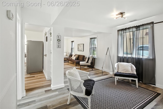 8411 Hugh St, Westland, MI 48185 - living area featuring wood finished floors and baseboards