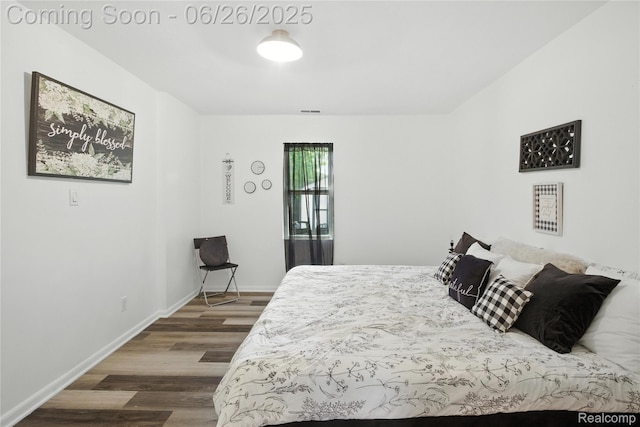 8411 Hugh St, Westland, MI 48185 - bedroom with wood finished floors and baseboards