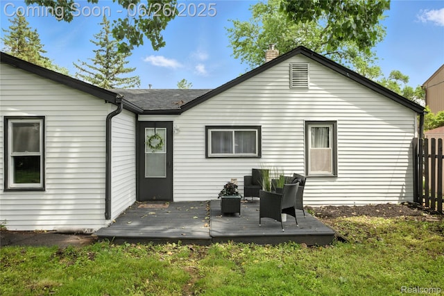 8411 Hugh St, Westland, MI 48185 - rear view of property with a deck, a chimney, and roof with shingles