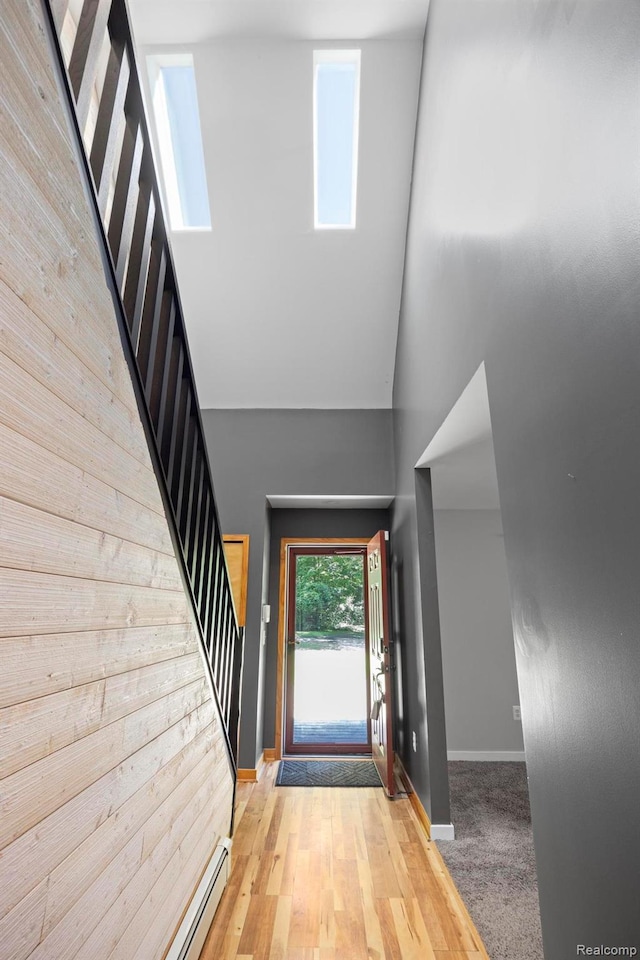 2931 N Lake Pleasant Rd, Attica, MI 48412 - entryway with stairs, wood walls, and a towering ceiling