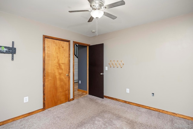 2931 N Lake Pleasant Rd, Attica, MI 48412 - unfurnished bedroom featuring carpet and a ceiling fan