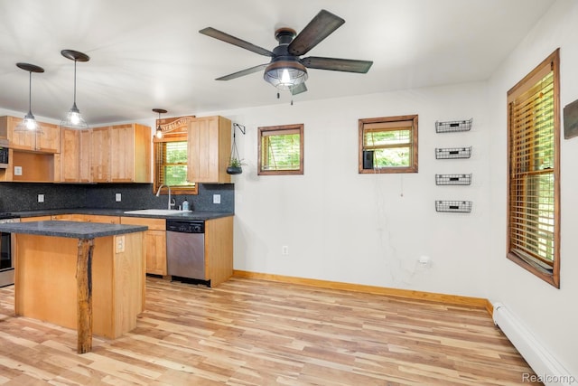 2931 N Lake Pleasant Rd, Attica, MI 48412 - kitchen with stainless steel appliances, a baseboard radiator, light wood-type flooring, and decorative backsplash