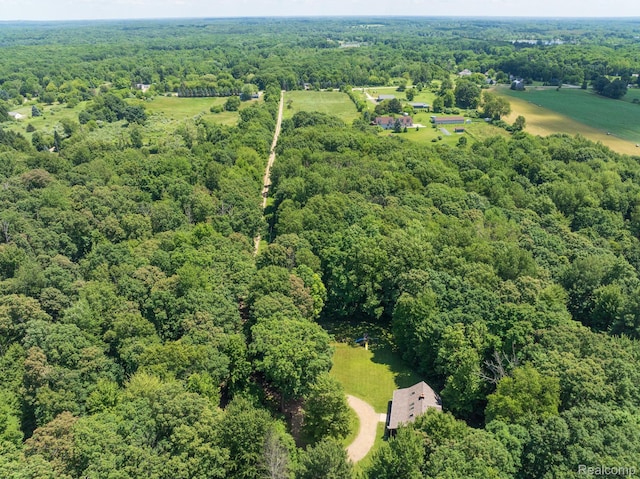 2931 N Lake Pleasant Rd, Attica, MI 48412 - aerial view of property and surrounding area featuring a heavily wooded area