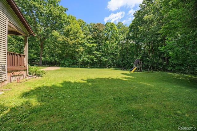 2931 N Lake Pleasant Rd, Attica, MI 48412 - view of grassy yard with a playground