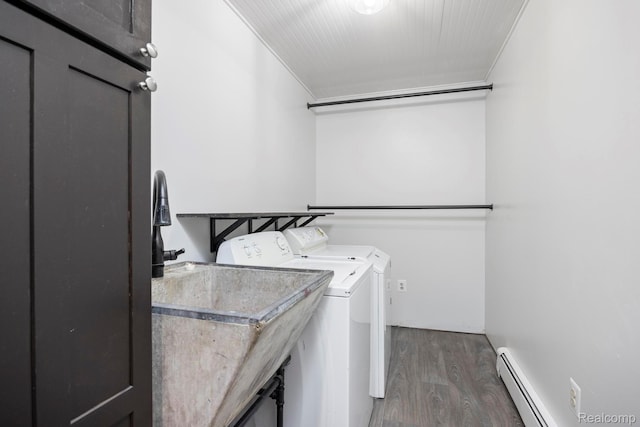 2931 N Lake Pleasant Rd, Attica, MI 48412 - laundry room featuring washing machine and dryer, wood finished floors, and baseboard heating