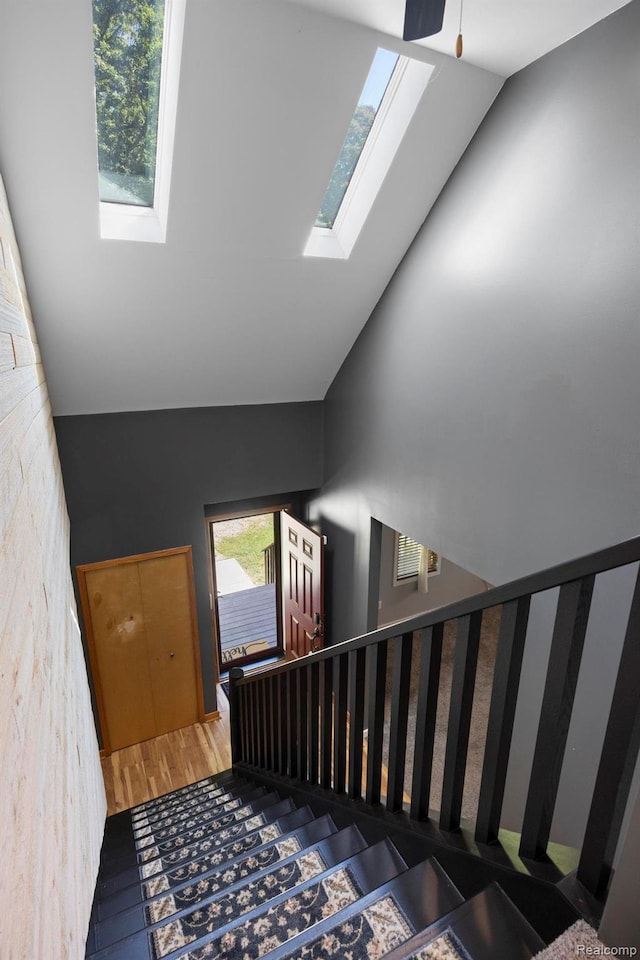2931 N Lake Pleasant Rd, Attica, MI 48412 - staircase with a skylight and vaulted ceiling