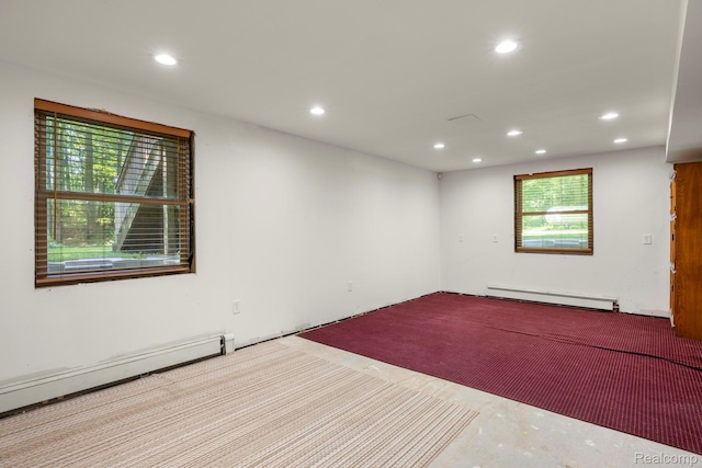 2931 N Lake Pleasant Rd, Attica, MI 48412 - unfurnished room with a baseboard radiator, baseboard heating, and recessed lighting