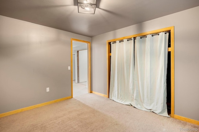 2931 N Lake Pleasant Rd, Attica, MI 48412 - unfurnished bedroom featuring carpet flooring and a ceiling fan