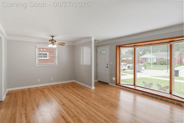 8639 Alper St, Westland, MI 48185 - entrance foyer with light wood-style flooring, ceiling fan, and ornamental molding