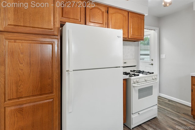 8639 Alper St, Westland, MI 48185 - kitchen with white appliances, wood finished floors, and brown cabinetry