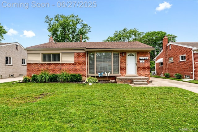 8639 Alper St, Westland, MI 48185 - view of front of home with brick siding, a front lawn, and a chimney