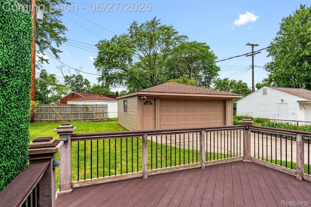 8639 Alper St, Westland, MI 48185 - deck featuring a detached garage, an outdoor structure, and a fenced backyard