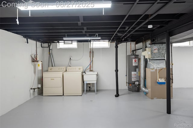 8639 Alper St, Westland, MI 48185 - basement featuring gas water heater, independent washer and dryer, electric water heater, and heating unit