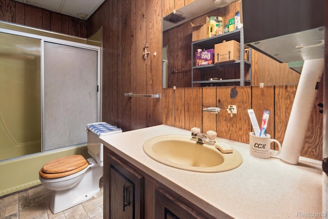 4800 S Huron Rd, Standish, MI 48658 - full bath featuring wood walls, vanity, and bath / shower combo with glass door
