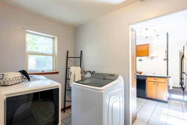 3541 Orshal Rd, Whitehall, MI 49461 - washroom with washer and clothes dryer and light tile patterned flooring