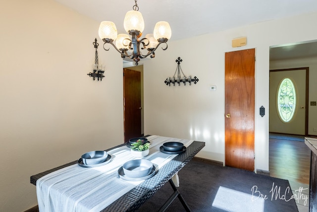 3541 Orshal Rd, Whitehall, MI 49461 - dining room featuring a chandelier and carpet floors
