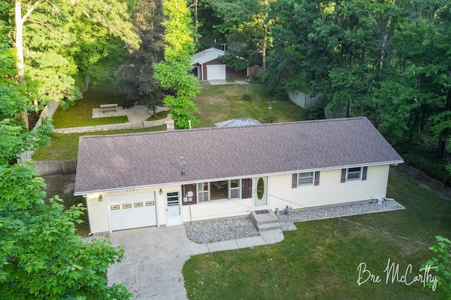 3541 Orshal Rd, Whitehall, MI 49461 - single story home featuring a garage, asphalt driveway, and a shingled roof