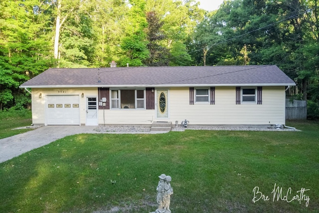 3541 Orshal Rd, Whitehall, MI 49461 - ranch-style house with a garage, concrete driveway, and a front lawn