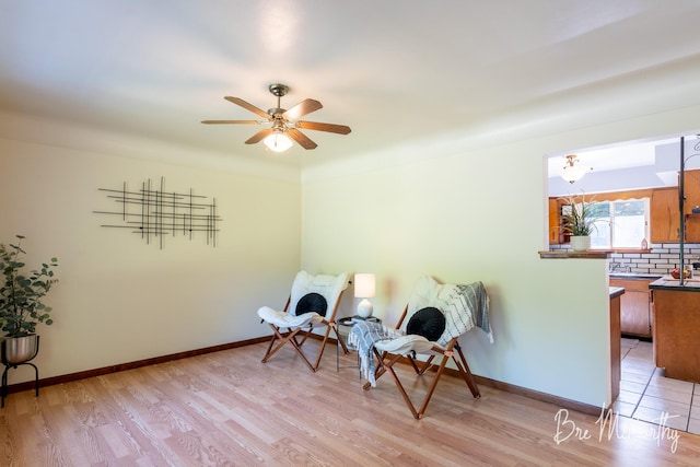 3541 Orshal Rd, Whitehall, MI 49461 - living area featuring light wood-type flooring and ceiling fan