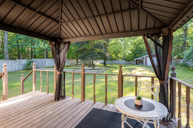 3541 Orshal Rd, Whitehall, MI 49461 - wooden terrace featuring a gazebo, a fenced backyard, and an outbuilding